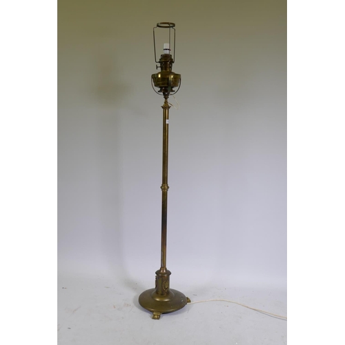 1103 - A Victorian brass standard lamp with oil reservoir, converted to electricity, 159cm high