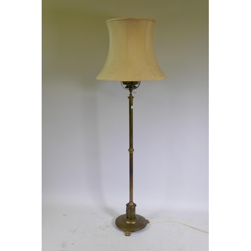 1103 - A Victorian brass standard lamp with oil reservoir, converted to electricity, 159cm high