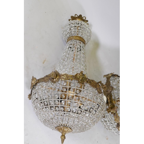 1111 - A pair of gilt metal and Empire style pendant ceiling lamps, 40cm diameter, 79cm high