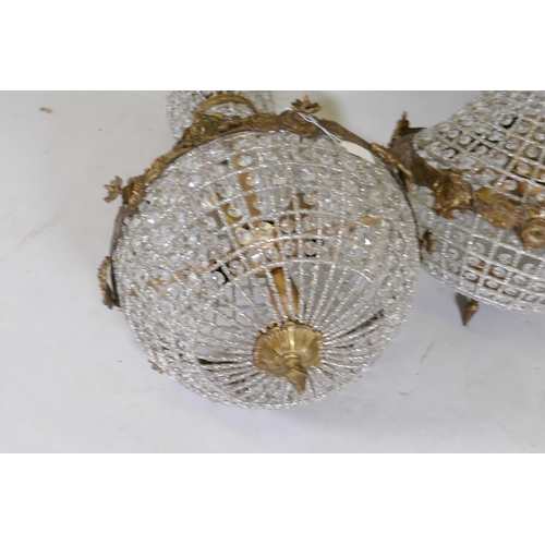 1111 - A pair of gilt metal and Empire style pendant ceiling lamps, 40cm diameter, 79cm high