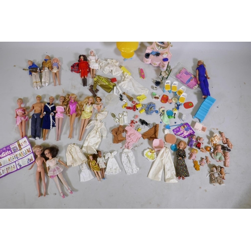 113 - A collection of vintage dolls, Barbie, Cindy, Matchbox Disco-Girls, Abba, various accessories and cl... 