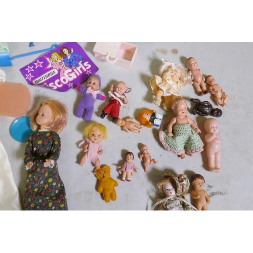 113 - A collection of vintage dolls, Barbie, Cindy, Matchbox Disco-Girls, Abba, various accessories and cl... 