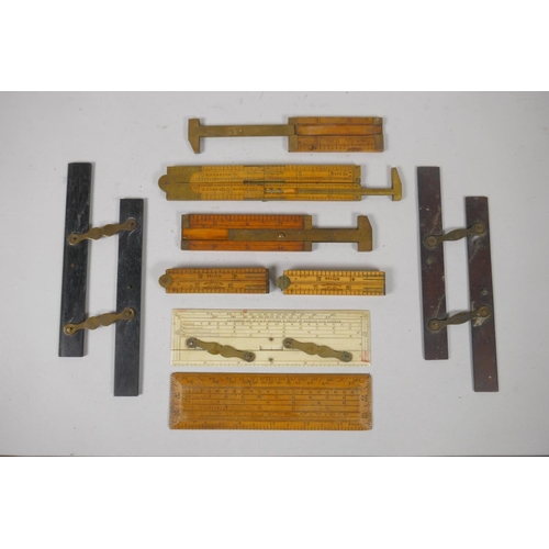 115 - A collection of vintage brass mounted wood and bone engineers rules, largest 61cm folded