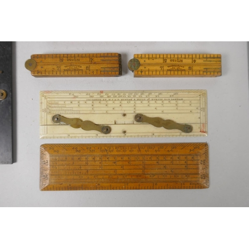 115 - A collection of vintage brass mounted wood and bone engineers rules, largest 61cm folded