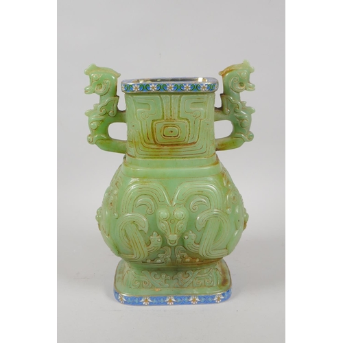 122 - A Chinese reconstituted green hardstone two handled vase with archaic style decoration, with Russian... 