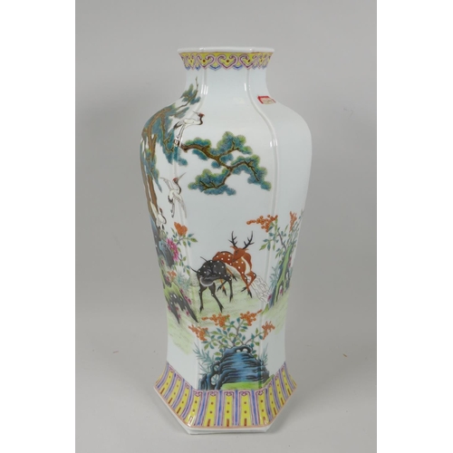 125 - A Chinese famille verte porcelain vase of hexagonal form decorated with cranes and deer in a landsca... 