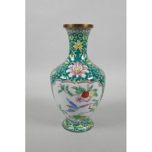 126 - A Chinese Canton enamel vase with decorative panels depicting birds, peaches and flowers, 20cm high