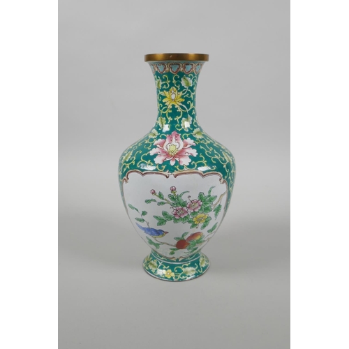 126 - A Chinese Canton enamel vase with decorative panels depicting birds, peaches and flowers, 20cm high