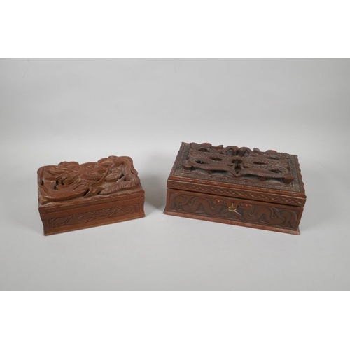 129 - An antique Burmese carved camphor wood jewellery box with entwined dragon decoration, and another sm... 