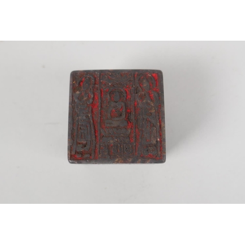 133 - A Chinese carved soapstone cube shaped seal, with images and inscriptions to each face, 5 x 5 x 5cm