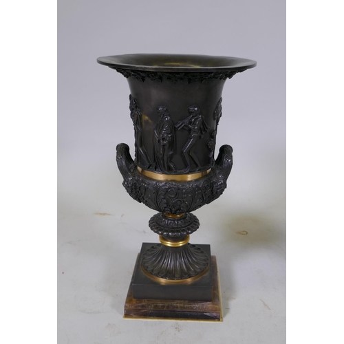 134 - A pair of Grand Tour style bronze urns with polished mounts and raised decoration, 37cm high