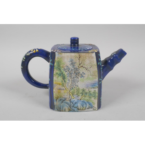 135 - A Chinese blue glazed YiXing teapot with decorative famille verte panels depicting landscape scenes,... 