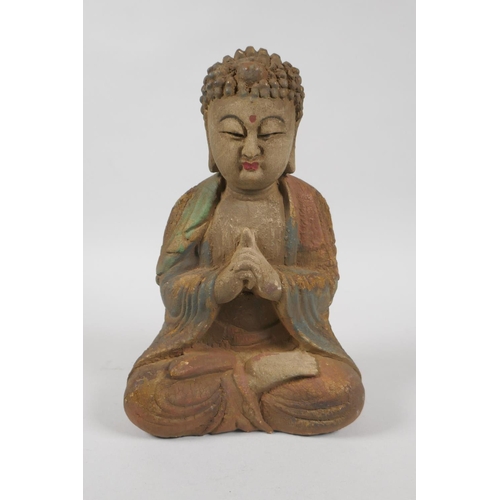 139 - A Chinese carved, painted and distressed wood figure of Buddha, 23cm high