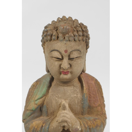 139 - A Chinese carved, painted and distressed wood figure of Buddha, 23cm high