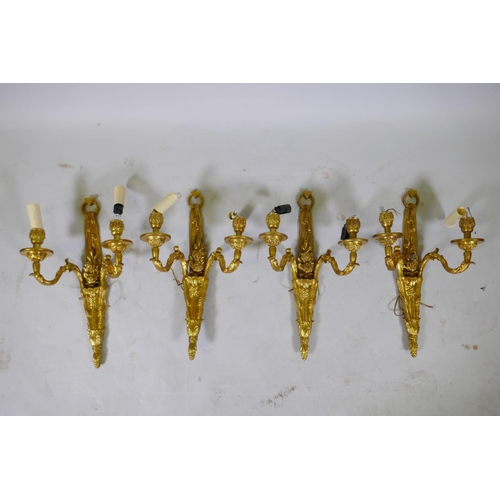 142 - Two pairs of ormolu two branch wall sconces with rose decoration, 46cm