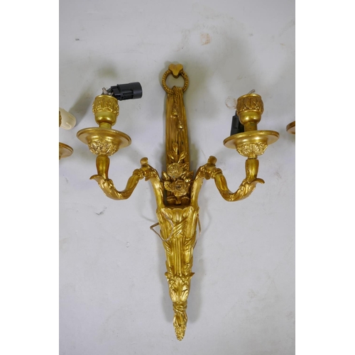 142 - Two pairs of ormolu two branch wall sconces with rose decoration, 46cm