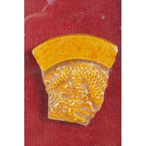 144 - A shard of amber glazed pottery roof tile depicting a dragon, purportedly from the Chinese Imperial ... 