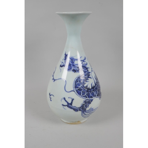 146 - A Chinese blue and white porcelain pear shaped vase with dragon decoration, 29cm high