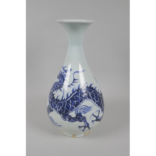 146 - A Chinese blue and white porcelain pear shaped vase with dragon decoration, 29cm high