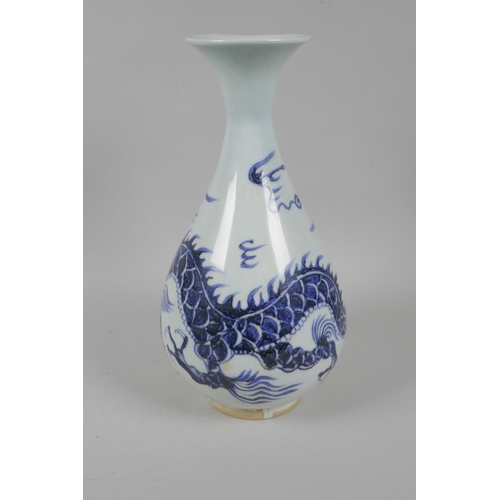 146 - A Chinese blue and white porcelain pear shaped vase with dragon decoration, 29cm high