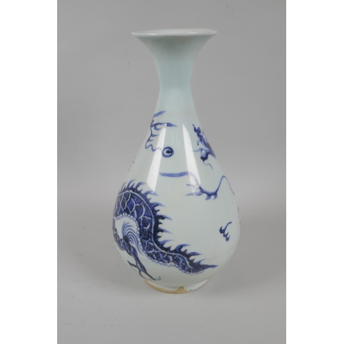 146 - A Chinese blue and white porcelain pear shaped vase with dragon decoration, 29cm high