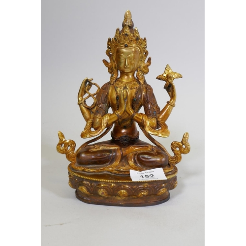 152 - A gilt bronze Buddhistic figure with inset bead decoration, 22cm high