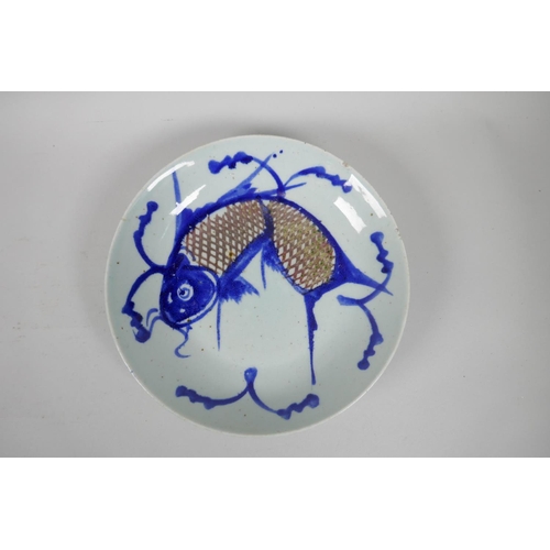 153 - A pair of Chinese late C19th/early C20th blue and white porcelain carp dishes, 23cm diameter