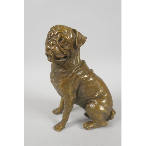 154 - A filled bronze figure of a pug dog, 18cm high