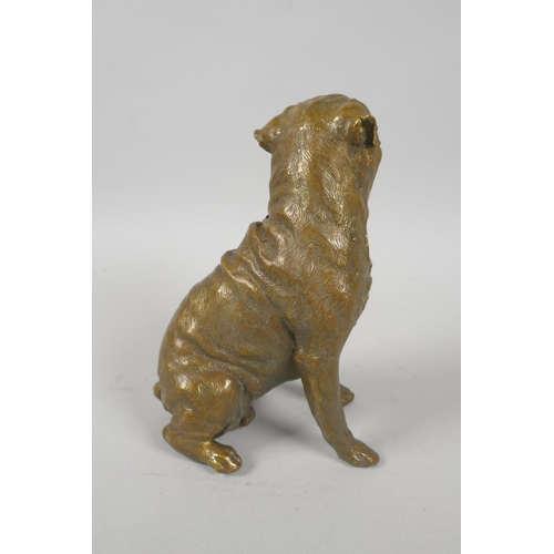 154 - A filled bronze figure of a pug dog, 18cm high