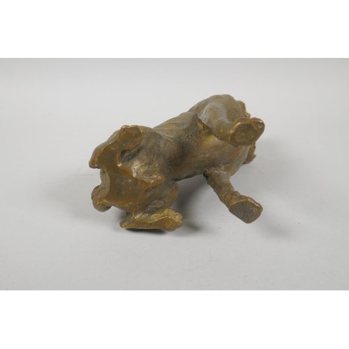 154 - A filled bronze figure of a pug dog, 18cm high