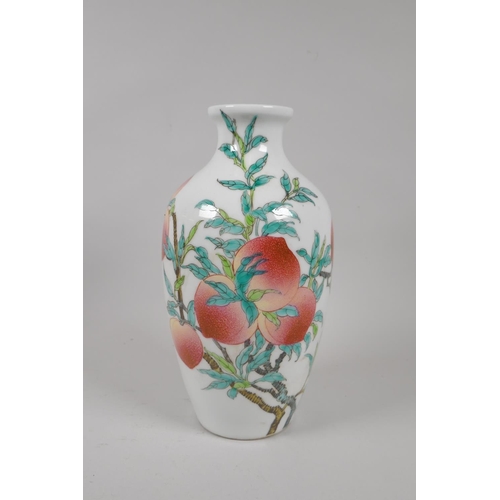 155 - A Chinese famille verte porcelain vase with peach tree decoration, Qianlong seal mark to base, 24cm ... 