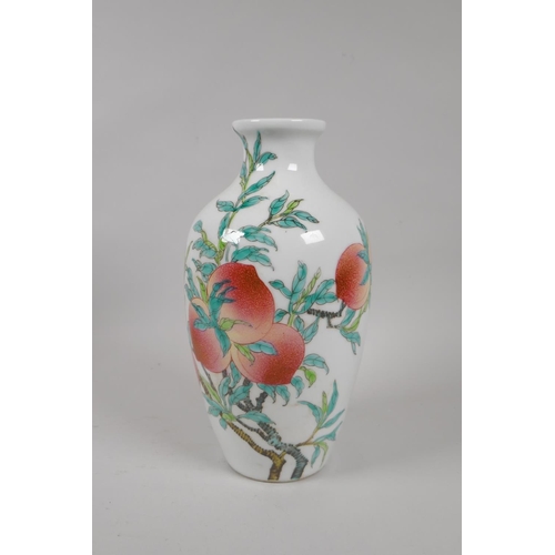 155 - A Chinese famille verte porcelain vase with peach tree decoration, Qianlong seal mark to base, 24cm ... 