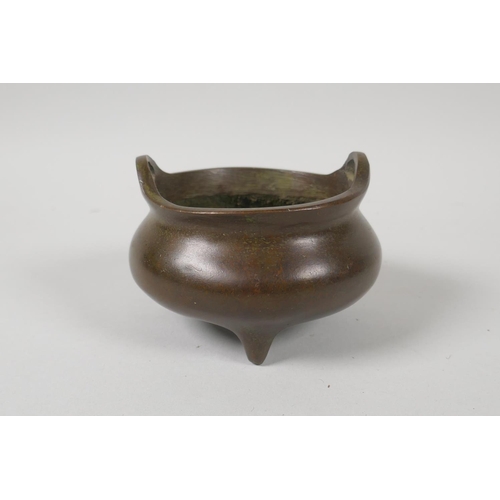 156 - A Chinese bronze censer with phoenix eye handles, impressed 4 character mark to base, 10cm diameter