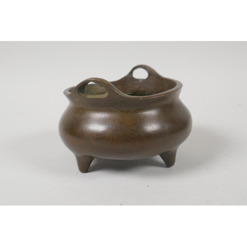 156 - A Chinese bronze censer with phoenix eye handles, impressed 4 character mark to base, 10cm diameter