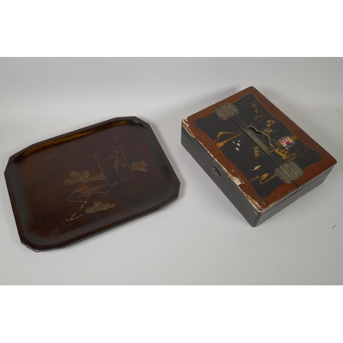 157 - A Japanese black lacquer jewellery box decorated with landscape scenes, and a carved hardwood tray, ... 