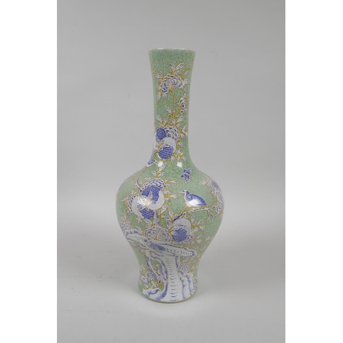 175 - A Chinese celadon crackle glazed porcelain vase with blue and white enamel pomegranate tree decorati... 