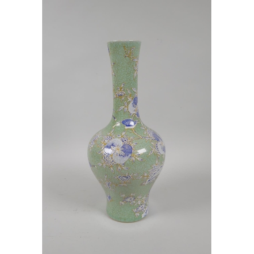 175 - A Chinese celadon crackle glazed porcelain vase with blue and white enamel pomegranate tree decorati... 