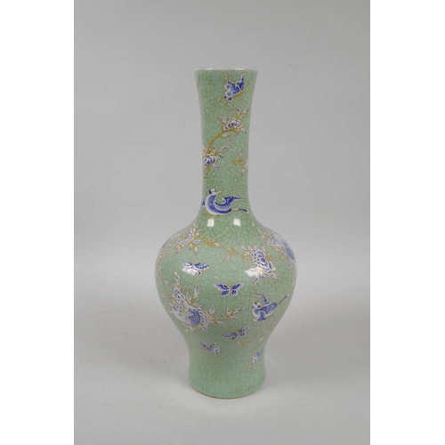 175 - A Chinese celadon crackle glazed porcelain vase with blue and white enamel pomegranate tree decorati... 