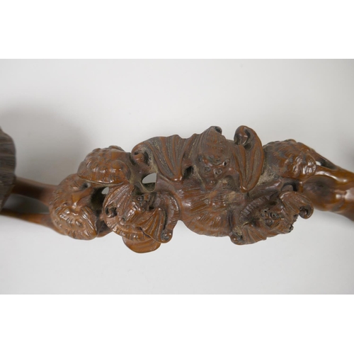 176 - A Chinese carved and pierced boxwood ruyi, 34cm long