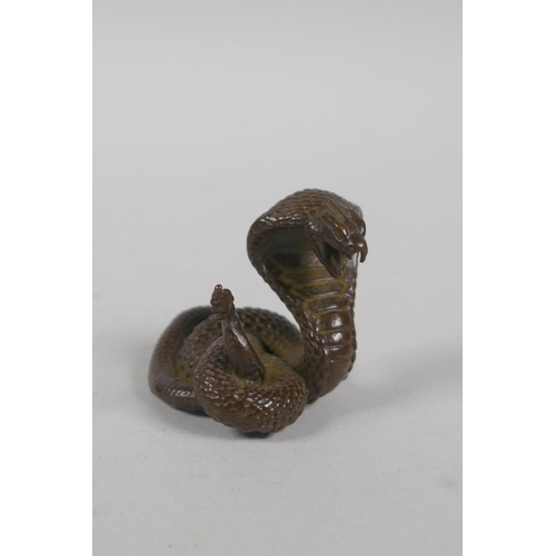 191 - A Japanese style bronze okimono cobra, 4cm high