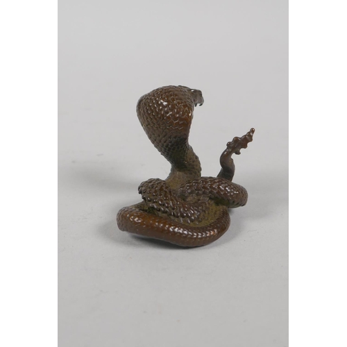 191 - A Japanese style bronze okimono cobra, 4cm high