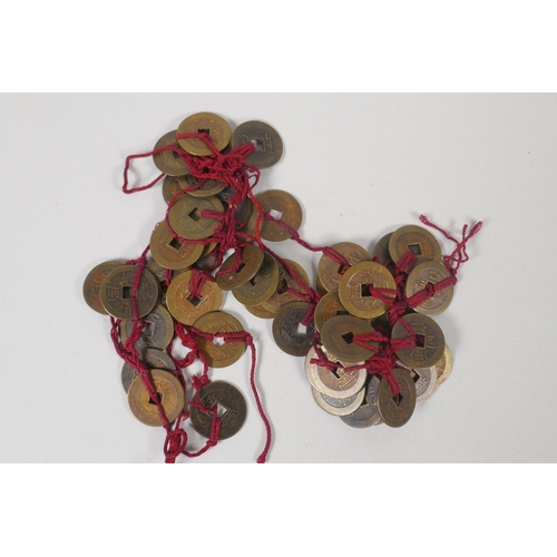 193 - A string of Chinese brass coins and a collectors' set of Song dynasty coinage