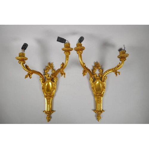 194 - Two pairs of ormolu two branch wall sconces with leaf decoration, 45cm 