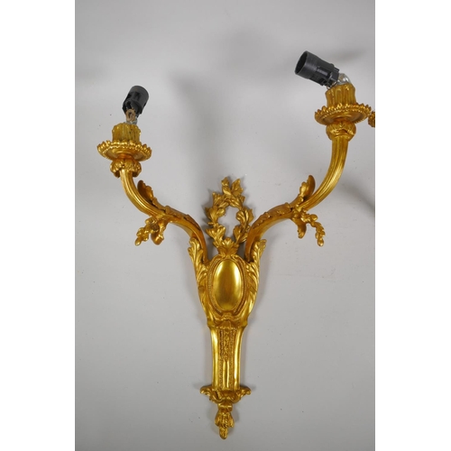 194 - Two pairs of ormolu two branch wall sconces with leaf decoration, 45cm 