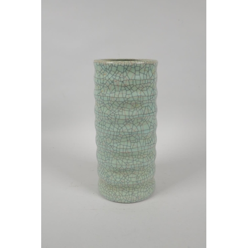 197 - A Chinese celadon crackleware ribbed cylinder vase, mark to base, 23cm high