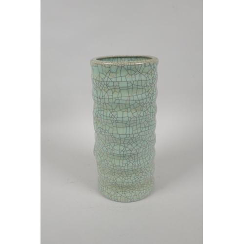 197 - A Chinese celadon crackleware ribbed cylinder vase, mark to base, 23cm high