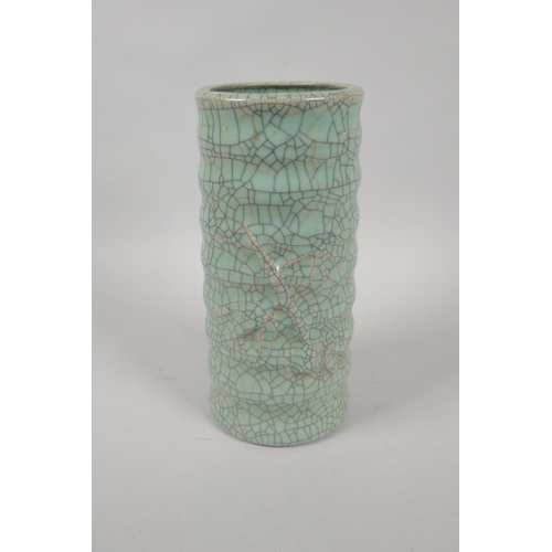 197 - A Chinese celadon crackleware ribbed cylinder vase, mark to base, 23cm high