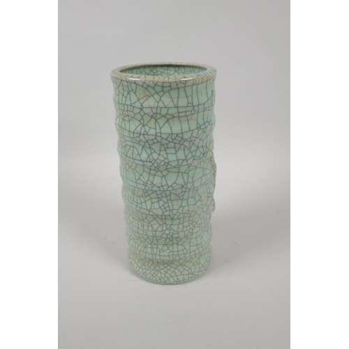 197 - A Chinese celadon crackleware ribbed cylinder vase, mark to base, 23cm high