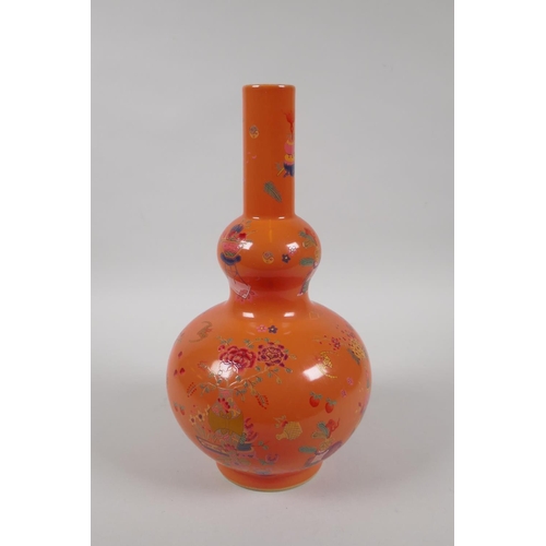 198 - A Chinese coral glazed porcelain double gourd vase with polychrome enamel decoration of objects of v... 