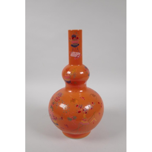 198 - A Chinese coral glazed porcelain double gourd vase with polychrome enamel decoration of objects of v... 